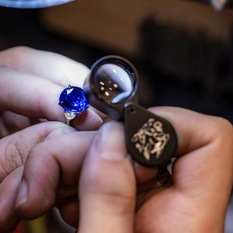 Pragnell specialist assessing jewellery during a repair and restoration consultation.