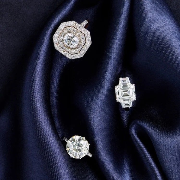 Three antique diamond rings showcasing different historic diamond cuts on a dark background