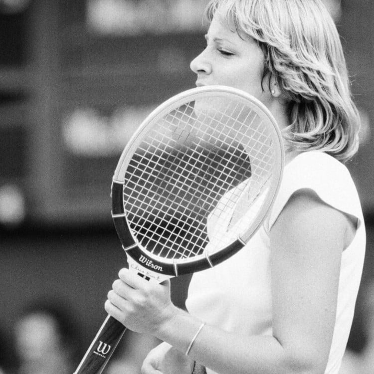 Chris Evert holding tennis racket, associated with the origin of the tennis bracelet name