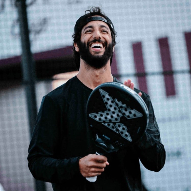 Daniel Ricciardo holding racket during the ADV Cup London event