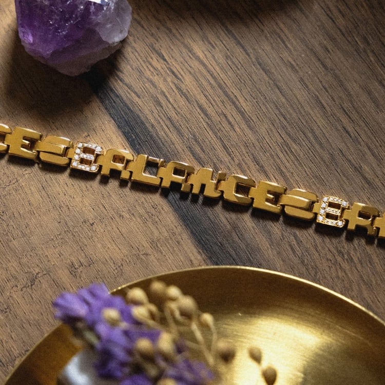 Close-up of a Loveletters bracelet showing interconnected personalised letter links.